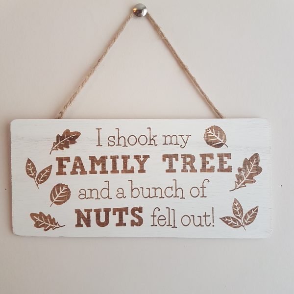 MDF board painted cream with the text in brown 'I shook my family tree and a bunch of nuts fell out!'