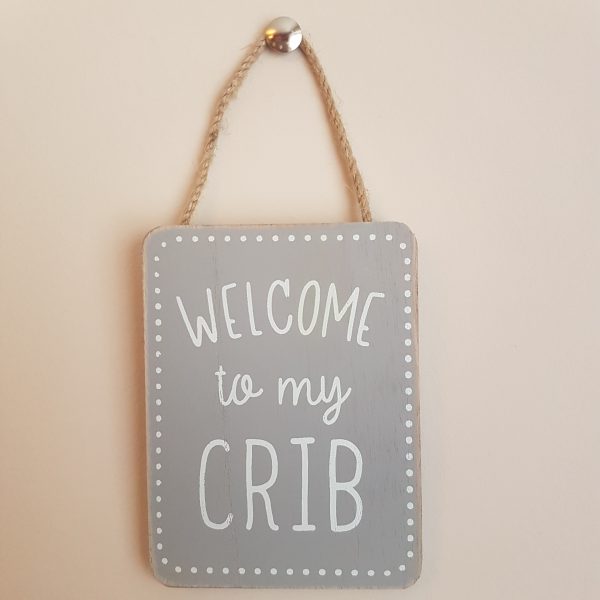 Small Grey wooden sign with white text 'Welcome to my Crib'