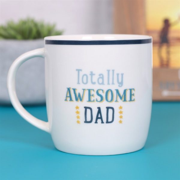 White ceramic mug with blue rim with the words in different shades of blue 'Totally Awesome Dad'