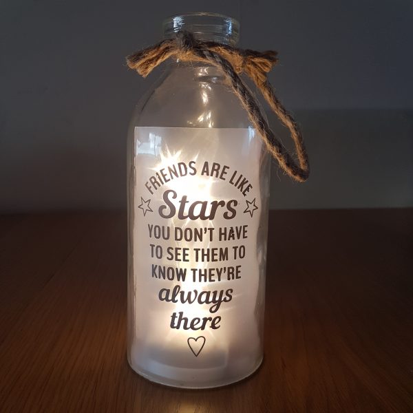 Glass bottle with LED lights, with the phrase; Friends are like stars, you don't need to see them to know they're always there. requires 3xAA batteries, not included