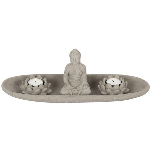 grey stone buddha with 2 lotus flower tealight holders on a tray