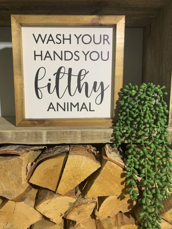 Handmade rustic sign 'Wash your hands you filthy animal'