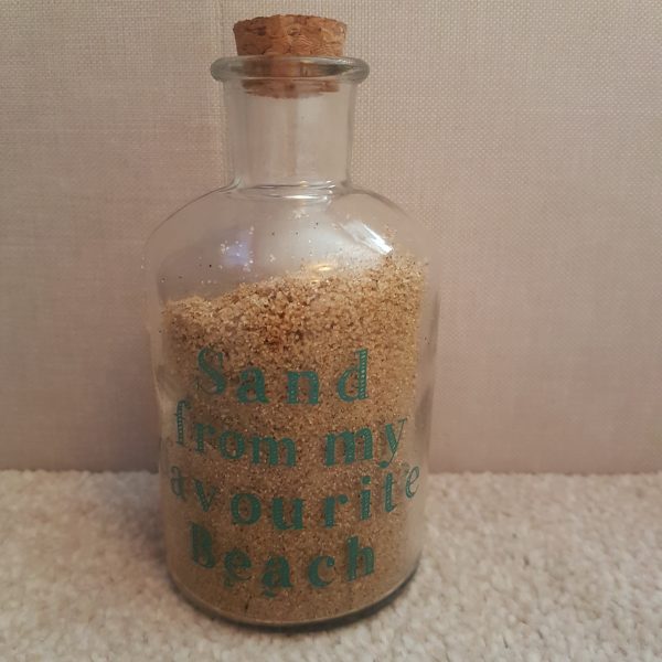Glass bottle with cork top with vinyl sticker 'Sand from my favourite beach'