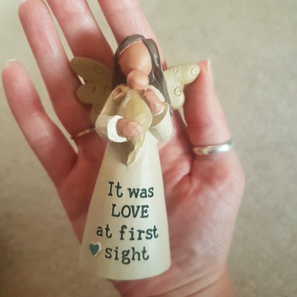 10cm Angel figure holding a baby with text at the bottom of the dress 'It was love at first sight'