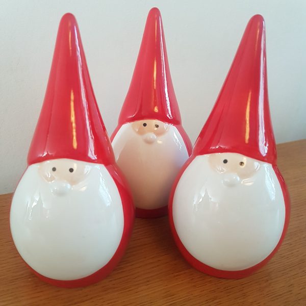 Festive red ceramic Santa figure with pointed hat