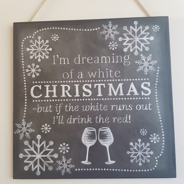 Black chalkboard with the quote 'I'm dreaming of a white Christmas, but if the white runs out I'll drink the red!
