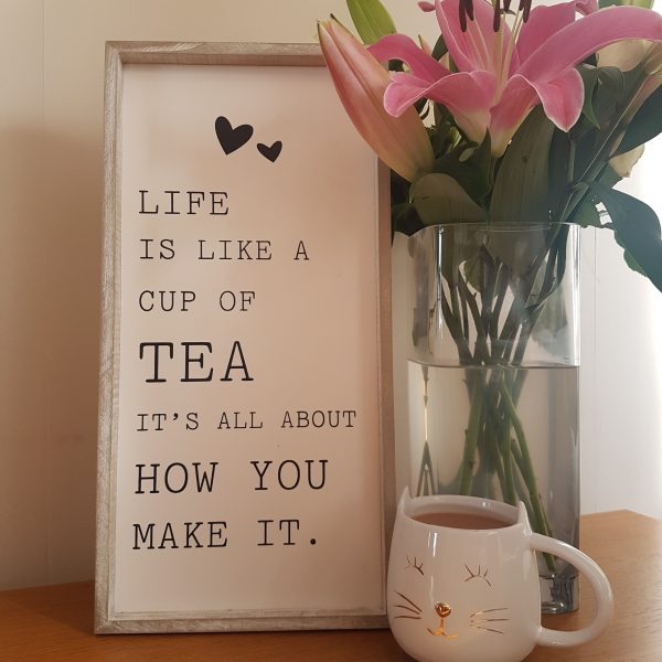 Wooden rustic frame with the quote 'Life Is Like A Cup Of Tea, It's All About How You Make It'
