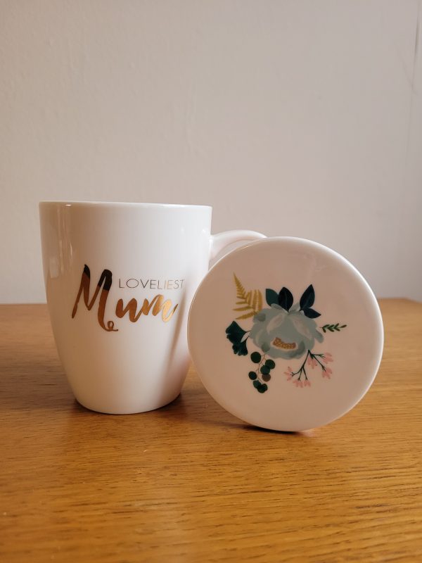 Lovely mug and coaster set with a pretty green and blue botanical pattern. Ceramic mug features the word 'Loveliest Mum' in gold and a hint of the botanical pattern on the inside. Set is gift wrapped in a plastic box with a pink ribbon. A perfect gift for any occasion especially mothers day.