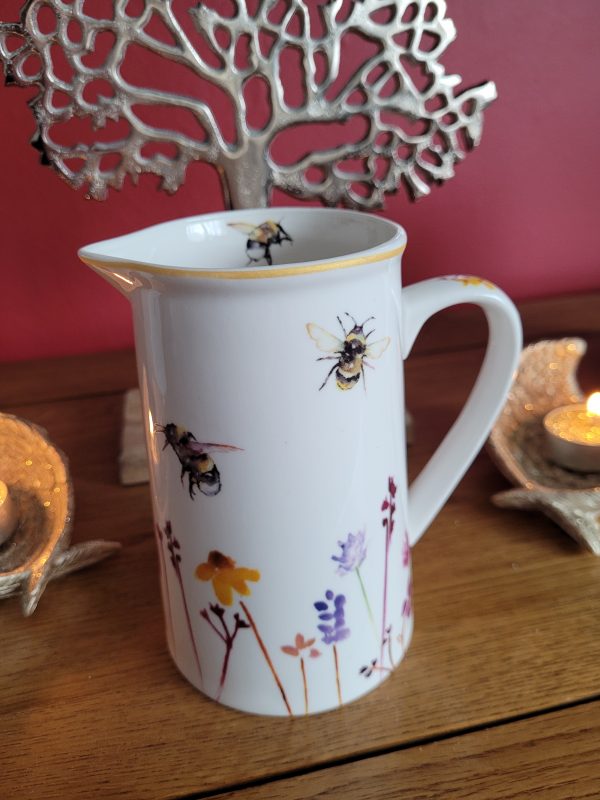 A smooth white ceramic jug with a beautifully printed Busy Bee Garden themed decal  This charming decorative item will be sure to bring a splash of colour to any kitchen worktop