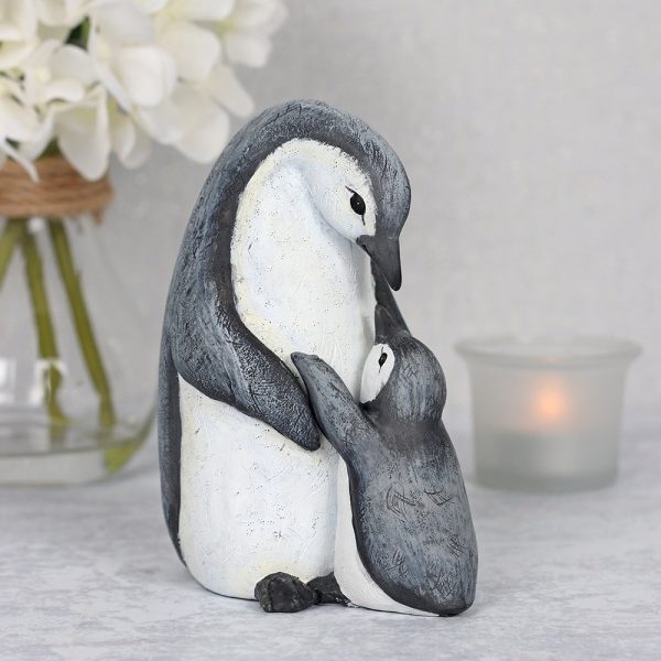 Mum and baby penguin ornament with a card which reads 'A mother with a heart of gold and love for her child that will never grow old'.