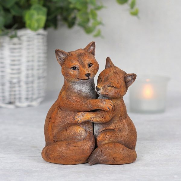 Fox couple cuddling together