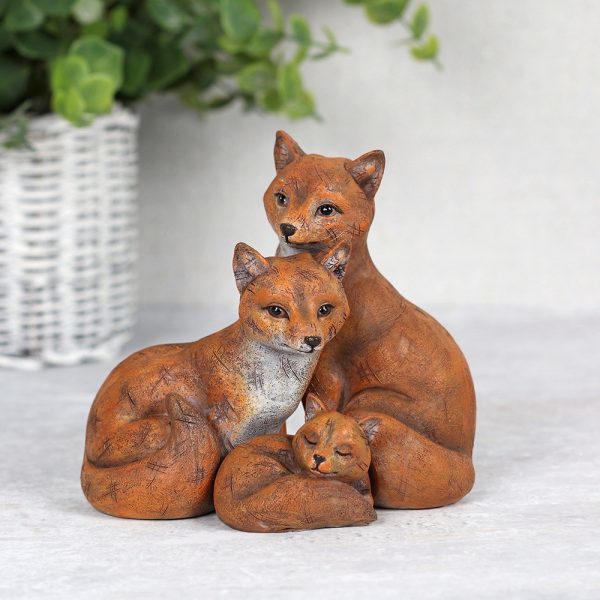 Fox family cuddling together