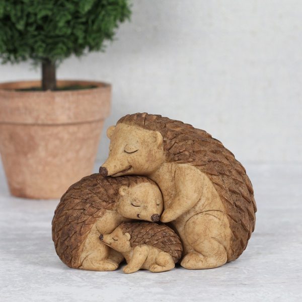This Hedgehog Family ornament shows parents and baby enjoying a warm embrace