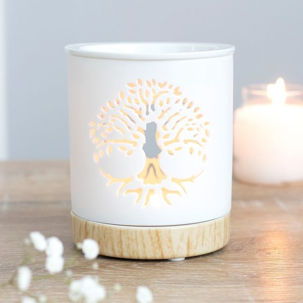 This white ceramic oil burner features a cut out Tree of Life design with a wood-effect ceramic base. Place fragrance oil or wax melts into the built-in dish with a standard tealight inside to fill the home with calming fragrance. 