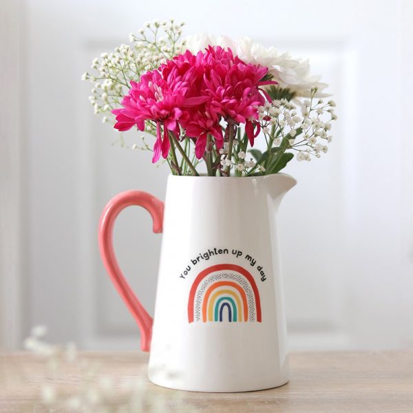 This ceramic jug has a simple yet beautiful design. The white jug has a pink handle and a rainbow design with the words 'You brighten my day'. Perfect for holding a bunch of fresh flowers to brighten up any room in the home.