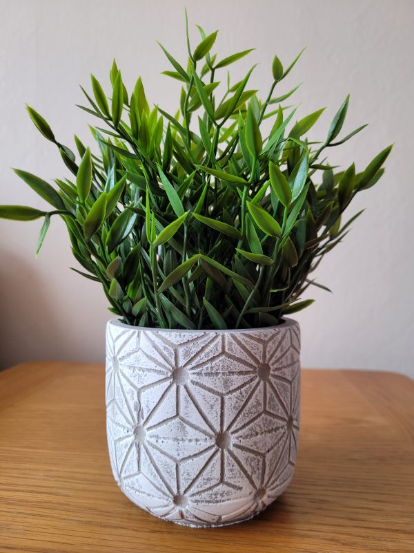 Small white geometric plant pot which would look lovely indoors or out.