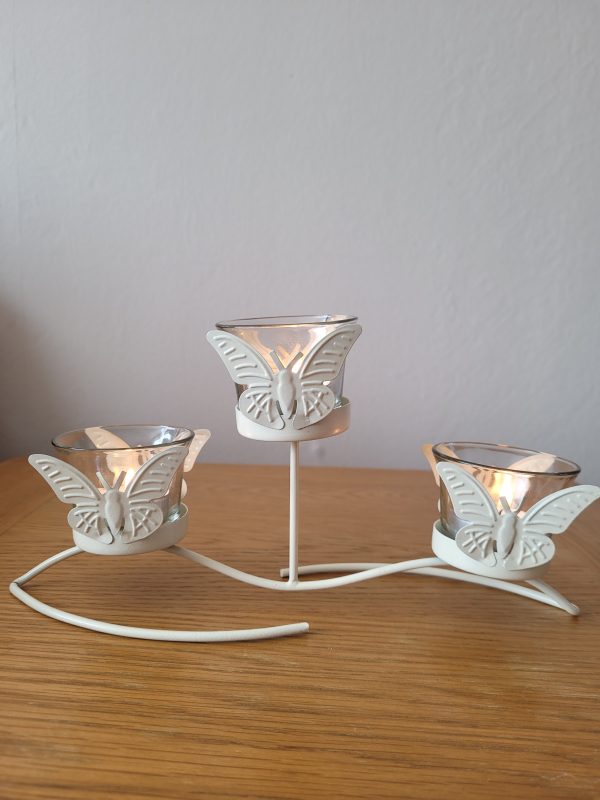 Add extra ambience to the home or garden with this triple butterfly tealight holder. These candle holders will look particularly lovely decorating an outdoor space on warm evenings.