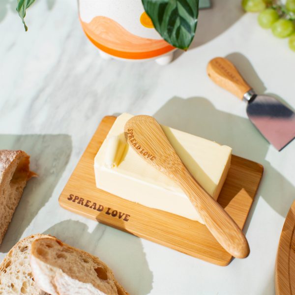 This delightful kitchen must-have features a minimal design made from 100% planet-friendly bamboo. Featuring the perfect sized butter dish, adorned with the quote 'spread love', and accompanied by a matching knife for slicing.