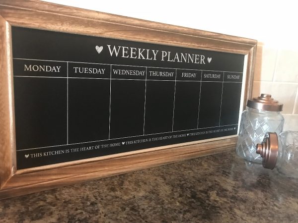 This gorgeous black weekly planner chalkboard with wooden frame is a must have for your kitchen, with lots of space to add daily meals, activities and anything else you need to remember