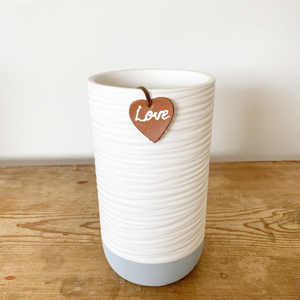 A classic 18cm white and grey coloured vase complete with a faux leather heart shaped tag which reads 'love'