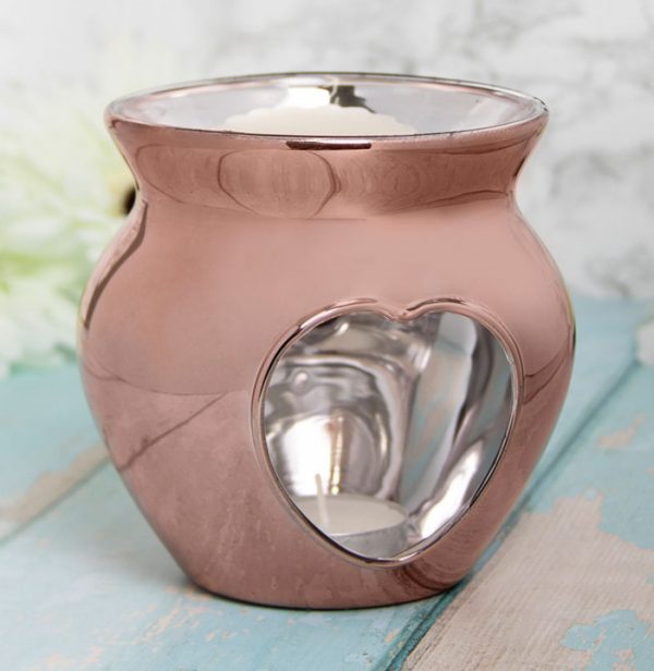 Perfect for bringing a sleek and simple look to any side space, a glass wax warmer featuring a Rose Gold coating.