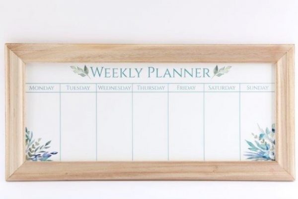 A large wooden framed Weekly Planner set with a charming Olive Grove decal to it  Perfect for placing in any home and using to keep track of the weeks appointments, meal plans and homework for kids!