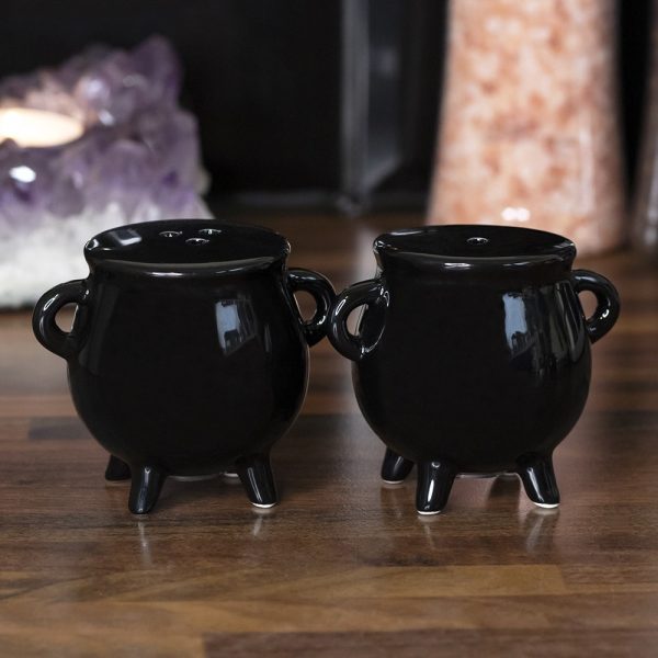 This adorable Cauldron Cruet Set is the perfect companion to our bestselling Witches Brew Cauldron Mug. Made with a rubber bottom stopper to keep salt and pepper contained. Do not microwave. Dishwasher safe. 