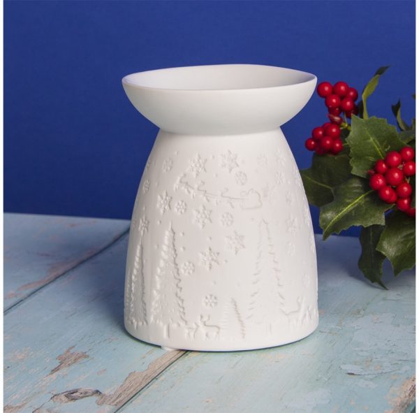 Perfect for projecting a cosy festive feel to your home at Christmas Time, a ceramic tealight holder with a Christmas embossed decal  With its dipped dish on top, this tealight holder is perfect for melting waxes and burning oils in the home for a cosy aroma 