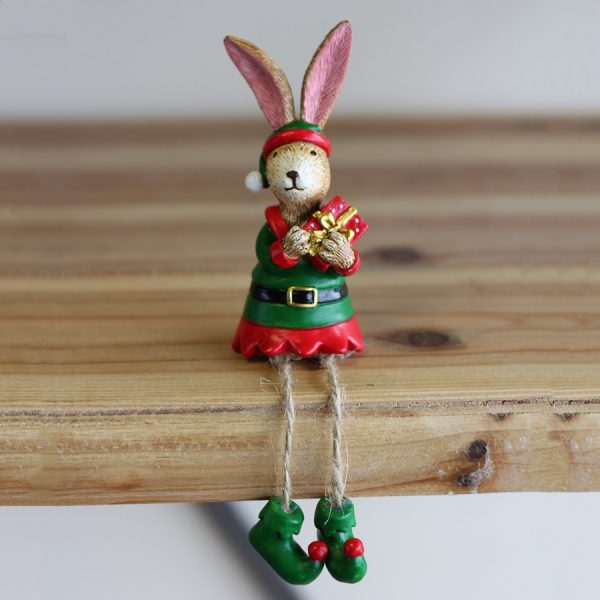 A festive little shelf sitting bunny dressed as an elf  Sure to bring a Christmassy feel to any space of the home 