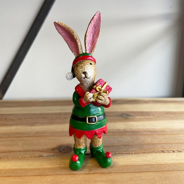 A cute little Christmas decoration to place within the home during the festive season  A posed standing bunny dressed as a Christmas Elf 
