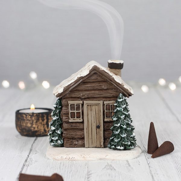 This charming log cabin incense cone burner is perfect for setting the scene on a cosy winter night in. Once the cone is lit the smoke comes out of the chimney making is look like a little log fire is burning within. Please note that this item can only be used with incense cones and some cones may take up to 10 minutes after lighting to begin producing enough smoke. 